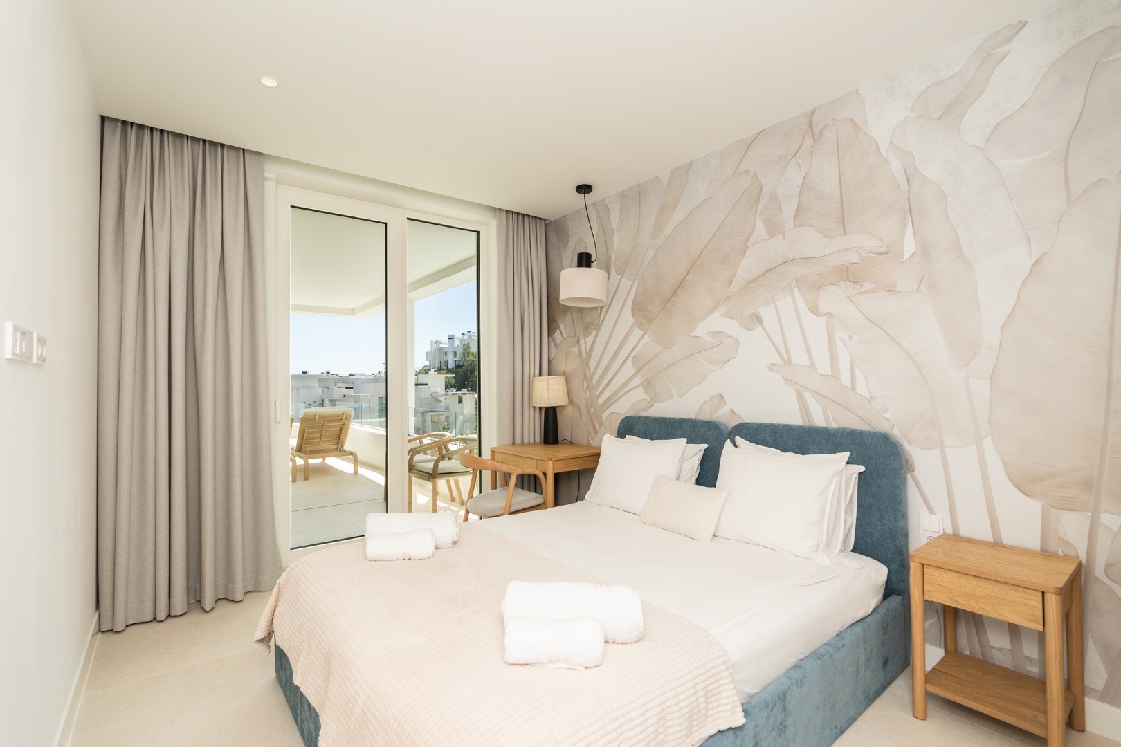 Luxury bedroom with terrace access in a Benahavís villa – real estate photography