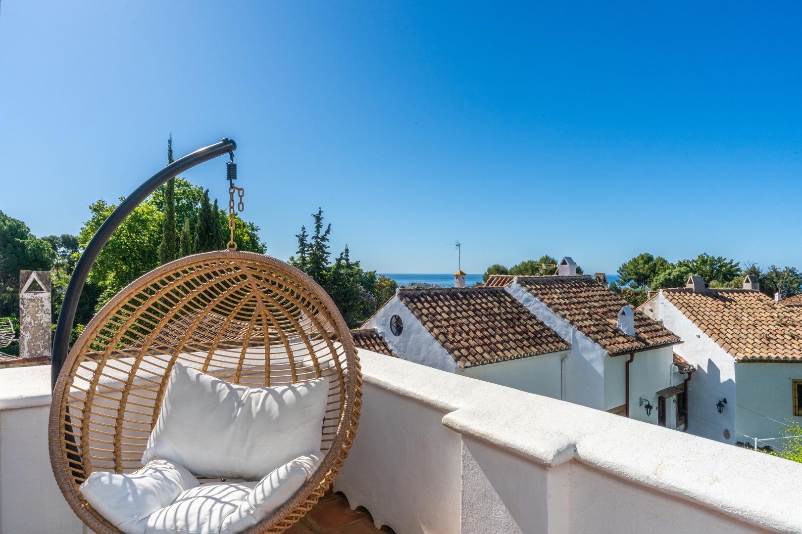 Terrace with hanging chair and sea views, Sotogrande – real estate photography