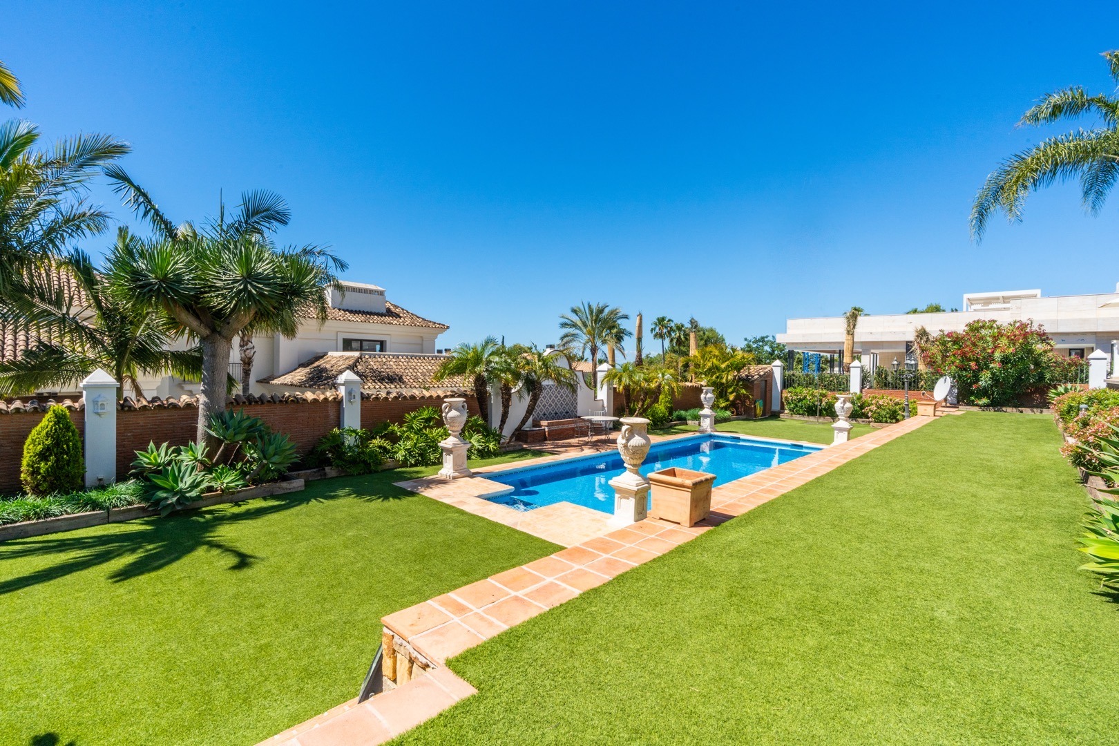 Manicured garden and pool at a Sotogrande villa, La Reserva – real estate photography