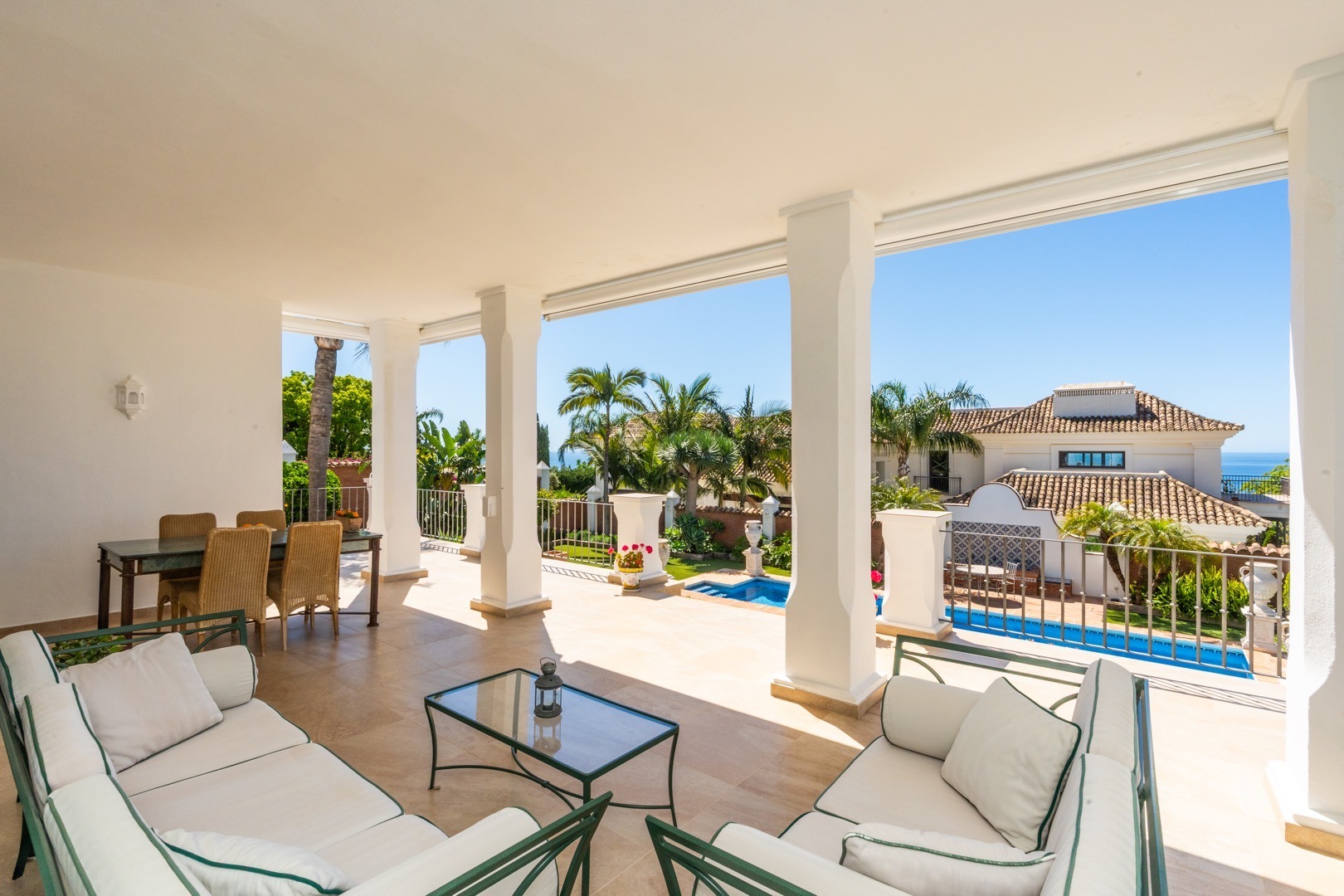 Covered terrace lounge with sea views, Sotogrande villa – real estate photography
